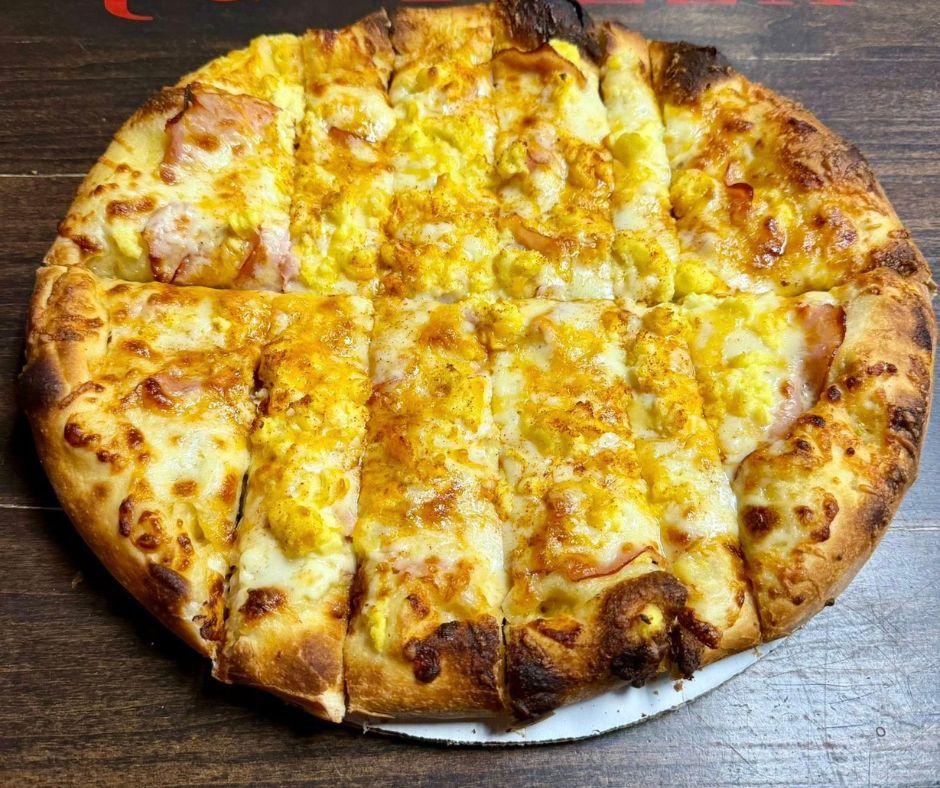 Eggs Benedict Pizza. We add creamy hollandaise base, fresh sliced 48hr. smoked Canadian bacon, fluffy scrambled eggs, house blend mozzarella. Eggs Benedict Pizza. We add creamy hollandaise base, fresh sliced 48hr. smoked Canadian bacon, fluffy scrambled eggs, house blend mozzarella.