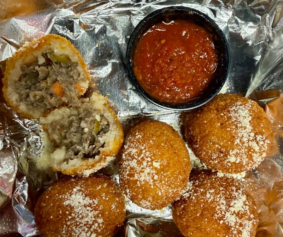 These Sicilian Arancini are the perfect little Italian rice balls stuffed with a Italian sausage and mozzarella cheese!